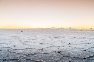 Scenic view of sea against sky at sunset