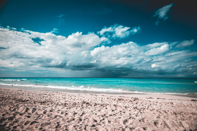 Scenic view of beach against sky