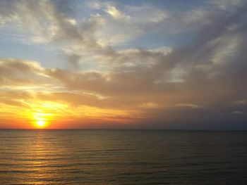 View of calm sea at sunset