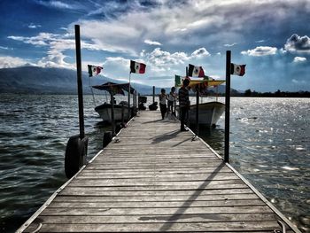Pier over sea against sky