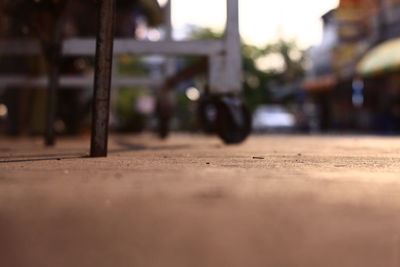 Surface level view of metal railing on table in city