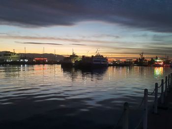 View of harbor against cloudy sky