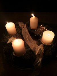 Close-up of illuminated tea light candles