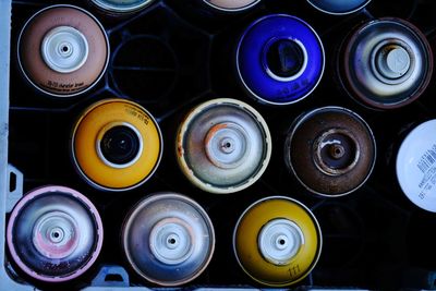 Full frame shot of multi colored spray paint bottles