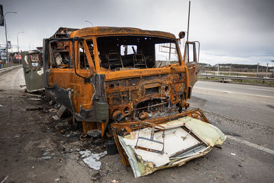 Military vehicles that burned down after being hit by a shell.