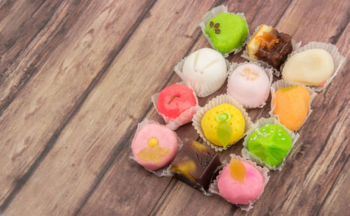 High angle view of wagashi on wooden table