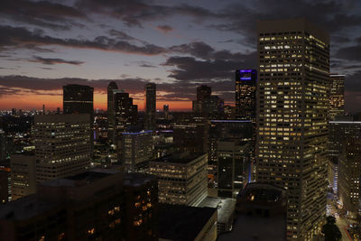 High angle view of illuminated buildings in city at night