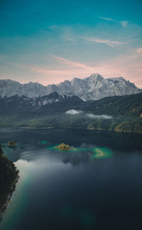 High angle view over lake eibsee with zugspitze mountains in background during sunset