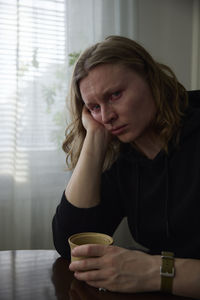 Crying woman looking at camera