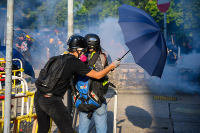 Man holding umbrella