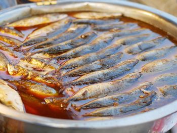 High angle view of fish on barbecue grill