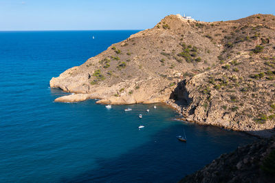 Scenic view of sea and rocks against sky