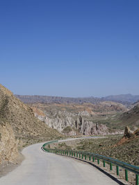 Scenic view of mountains against clear blue sky