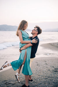 Side view of woman standing on beach