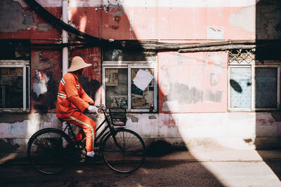 Man riding bicycle in city