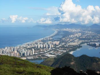 High angle view of city against cloudy sky