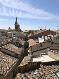 High angle view of buildings in town against sky