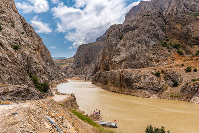 Panoramic view of land and mountains against sky