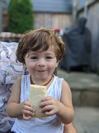 Portrait of boy holding ice cream