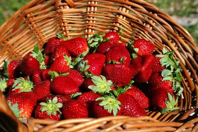 High angle view of strawberries in wicker basket