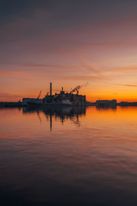 Ship in sea against sky during sunset