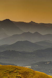 Scenic view of mountains against sky during sunset