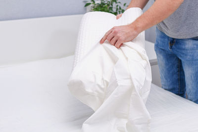 Low section of woman standing on white floor