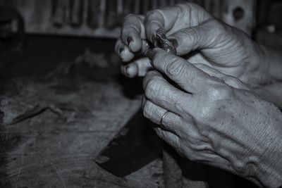 Close-up of man holding hands