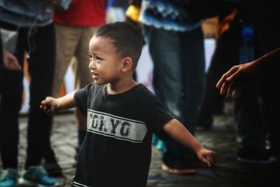 Boy standing outdoors