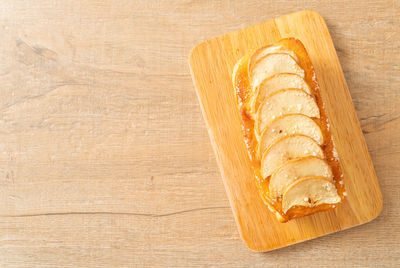 High angle view of bread on cutting board