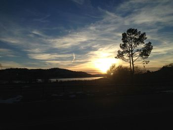 Scenic view of landscape against sky at sunset