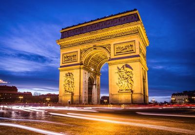 View of light trails by arc de triomphe