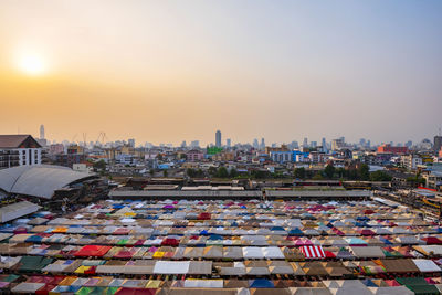 High angle view of buildings against sky during sunset