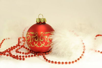 Close-up of christmas decorations over white background
