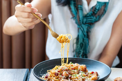 Midsection of woman preparing food