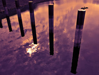 Reflection of clouds in water during sunset