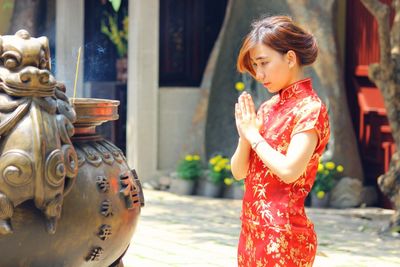 Woman praying in temple