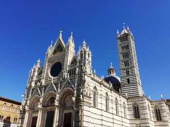 Low angle view of cathedral against blue sky