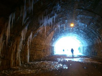 Full length of woman in tunnel