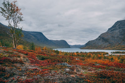 Scenic view of mountains and lake against sky