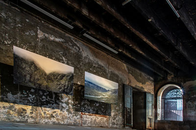 Low angle view of window in abandoned building