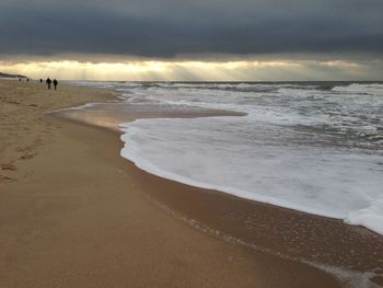 Scenic view of calm sea at sunset