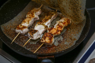 High angle view of meat on barbecue grill