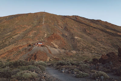 Scenic view of mountain road against clear sky