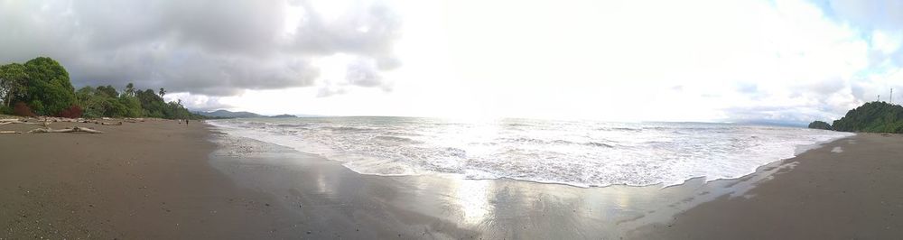 Panoramic view of beach against sky