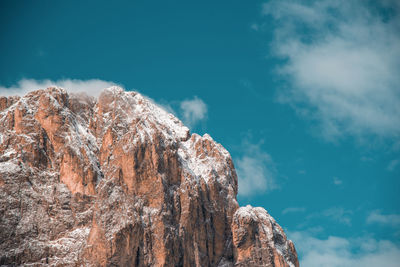 Low angle view of rock formation against sky