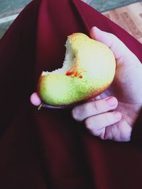 Close-up of cropped hand holding ice cream