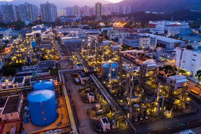 High angle view of illuminated buildings in city at night