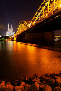 Bridge over river at night