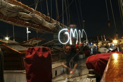 People in illuminated city at night